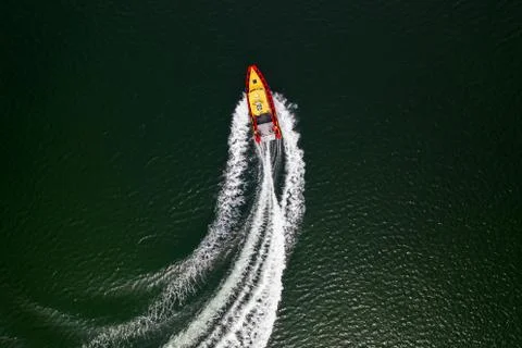 Top down view on speed movement of rescue motorboat. Stock Photos