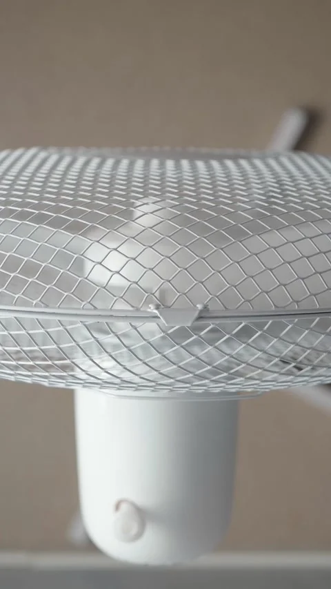 Top down view of spinning floor fan Stock Footage 346059121