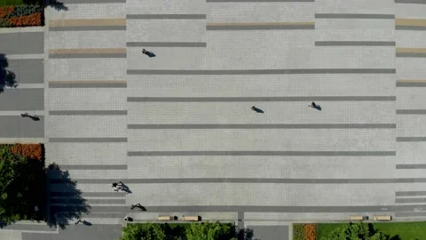 Top Down View of Square with Horizontal Lines Pattern and Walking People Stock Footage 222836226