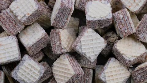 Top down view. Stack of square-shaped chocolate-filled wafers. Slider shot. Stock Footage 296566544