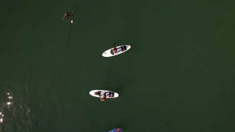 Top down view of standup paddlers on the water Stock Footage 252068709