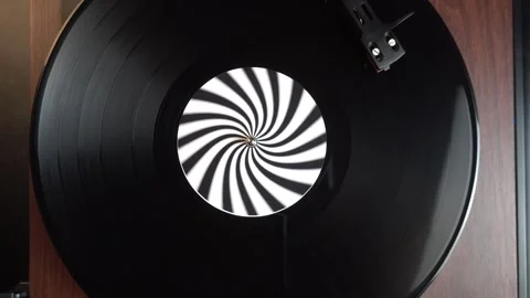 Top Down View, Starting Playback of Music on Vinyl Record With Optical Illusion Stock Footage 335969583