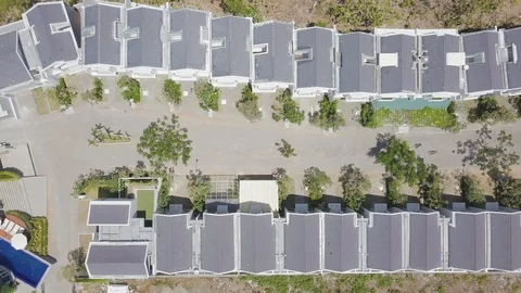 Top down view on the street of the cottage town zoom out aerial footage Stock Footage 100637560