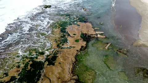 Top down view of a surreal, colorful geothermal hot spring. Aerial video. Stock Footage 153475451