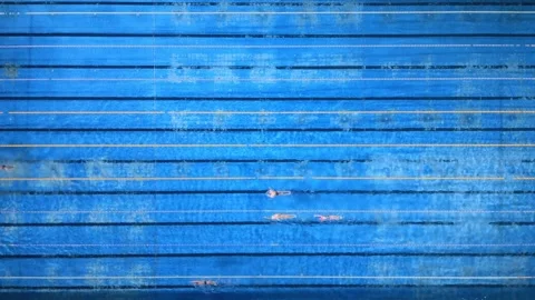 Top-down view of a swimming pool with lanes and swimmers in action. Stock Footage 297471950