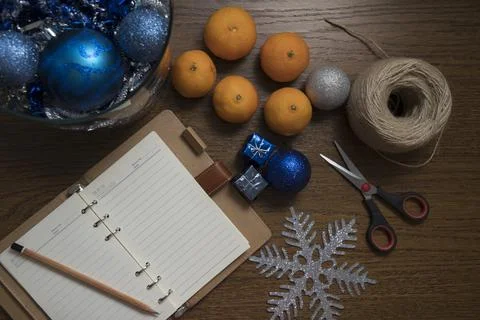 Top down view on table with Christmas decoration setup and tangerines. Stock Photos