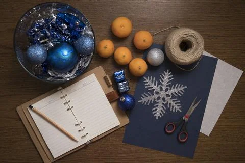 Top down view on table with Christmas decoration setup and tangerines. Stock Photos