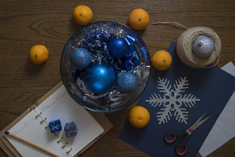 Top down view on table with Christmas decoration setup and tangerines. Stock Photos