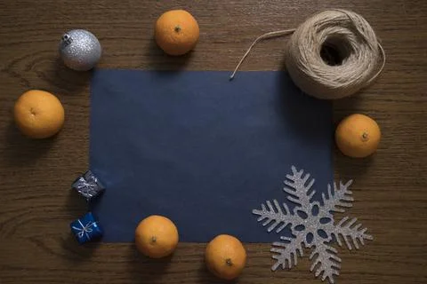 Top down view on table with Christmas decoration setup and tangerines. Stock Photos
