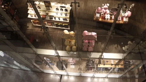 Top-down view through glass of a stylish shopping mall boutique. Elegant display Stock Footage 305176261