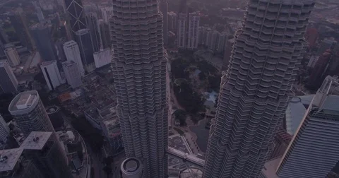 Top Down View With Tilt Revealing Sunrise Over Skyscrapers in Kuala Lumpur Stock Footage 76177158