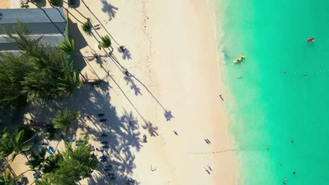 Top-down view of tourists arriving at a tourist beach in Punta Cana by kayak Stock-Footage 308023762