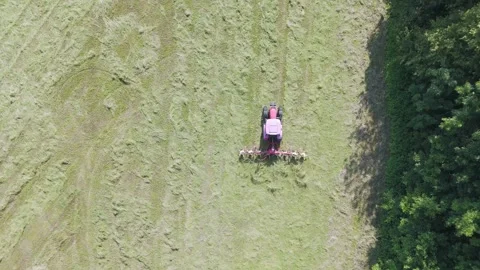 Top down view of tractor harvesting grass Stock Footage 312069994
