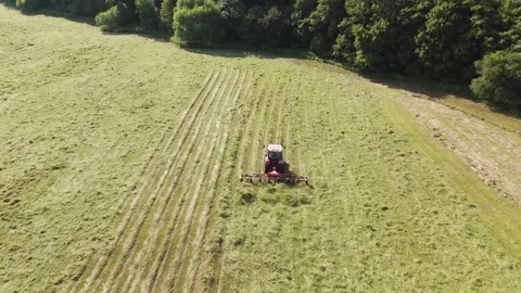Top down view of tractor harvesting grass Stock Footage 312070004