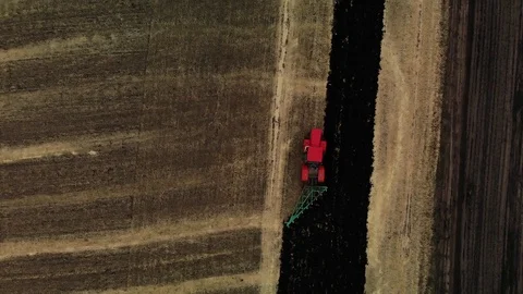 Top down view Tractor plowing fields, preparing land for sowing. Aerial view Stock Footage 114047210