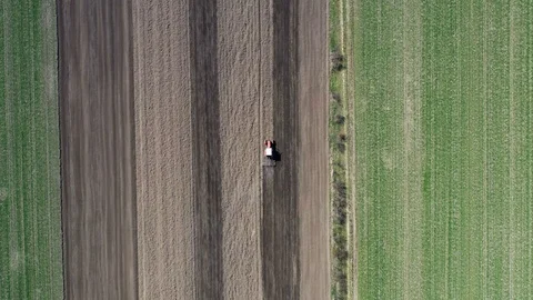 Top down view Tractor plowing fields, preparing land for sowing. Stock Footage 127195688