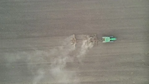 Top down view of Tractor plowing a field Stock Footage 198921237