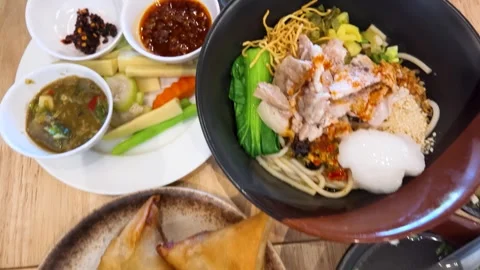 Top Down View of Traditional Burmese Cuisine Dishes on Table Stock Footage 345103112