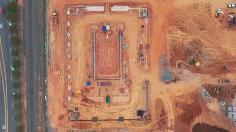 Top down view of traffic passing a construction site Stock Footage 343796268