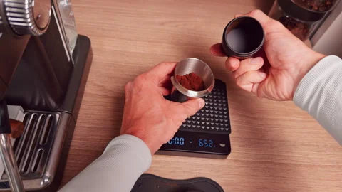 Top Down View Transferring Fresh Ground Coffee into Metal Dosing Cup on Digital Stock Footage 328857716