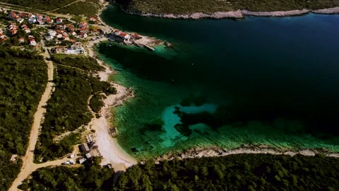Top down view of a tropical Mediterranean town located on an island beach Stock Footage 169004389