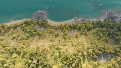 Top down view of turquoise river with shore, shooted from drone Stock Footage 112365410
