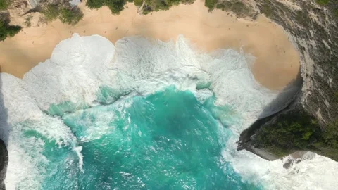 Top-down view of turquoise waves crashing onto Kelingking Beach Nusa Penida Bali Stock Footage 340188721