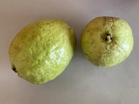 Top-Down View of Two Fresh Guavas on the Table Stock Photos