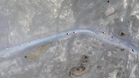Top down view of two red jeep cars on the Mount Bromo desert in East Java Stock Footage 331231229