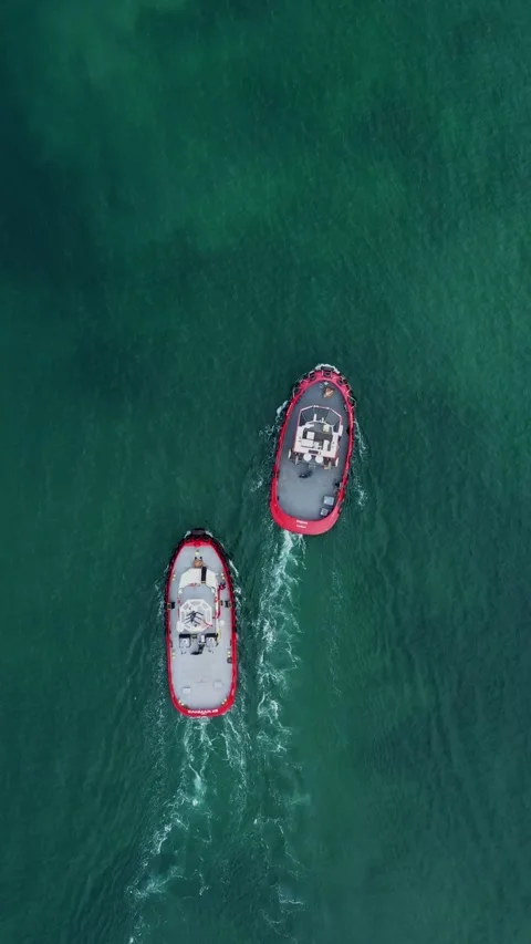 Top down view of a two tugs in sea. Logistics and transport 動画素材 299705055