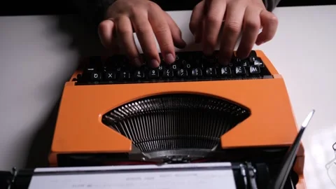 Top-Down View of Typing on a Typewriter Stock Footage 318590815