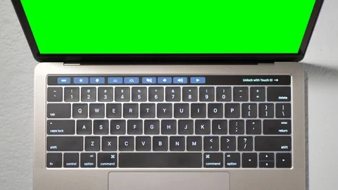 Top Down View of Unbranded Laptop with Green Chroma Screen and Keyboard Close Up Stock Footage 86142497