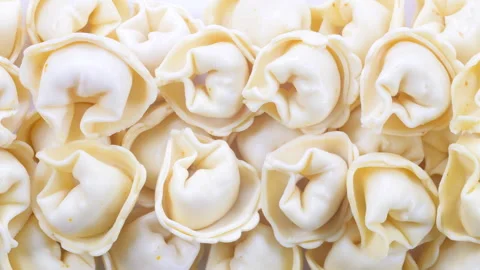 Top down view. Uncooked italian pasta ravioli tortellini. Close up view. Stock Footage 296563526
