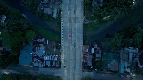 Top down view of urban bridge with traffic and river at blue hour. Stock Footage 337797065