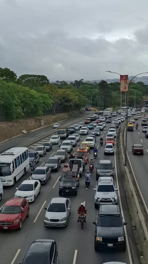 Top-Down View of Urban Traffic with Greenery – Caracas, Venezuela Stock Footage 309347948