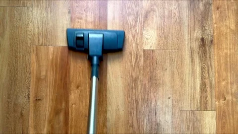 Top down view of vacuuum cleaner, vacuuming modern wooden floor, cleaning house Stock Footage 315474340