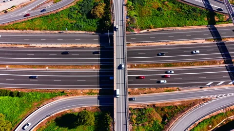 Top down view of vehicles crossing a highway bridge, Spain Stock Footage 344693906