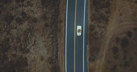 Top down view of a vintage convertible driving on a country road Stock Footage 118052314