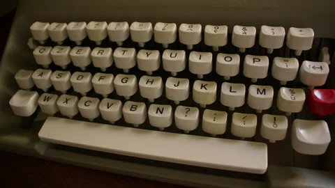 Top down view of a vintage typewriter keyboard with white keys  Видео 300142083