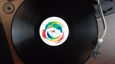 Top Down View of Vintage Vinyl Record With Colorful Sticker Spinning on Stock Footage 337998278