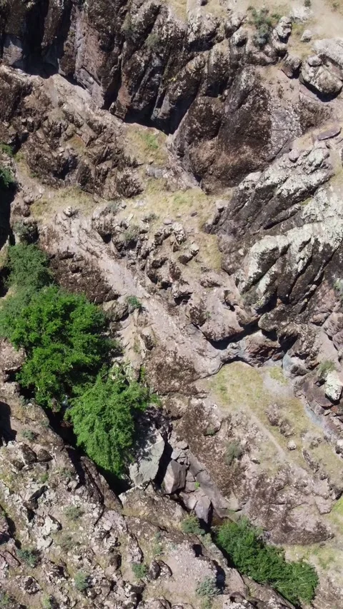 Top down view of volcanic rock texture and deep canyon crevices in Kazakhstan Stock Footage 338124565