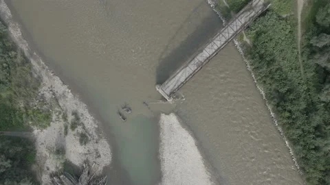 Top-down view of the war-destroyed bridge. Old metal arch bridge. Stock Footage 138195859
