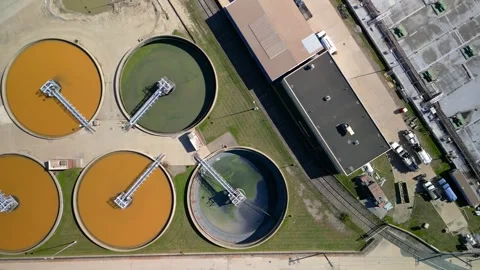Top down view of waste water treatment plant processing colorful water. Stock Footage 320448215