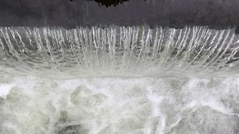Top-Down View Of Water Flowing Over A Small River Diversion Dam Vídeo Stock 167141093