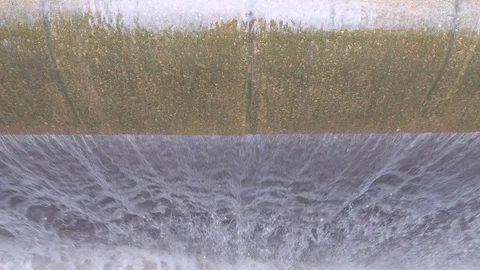 Top down view of a waterfall gushing over the edge in a water fountain Stock Footage 122081205