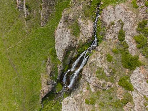 Top down view of waterfall on a rocky cliff Stock Photos