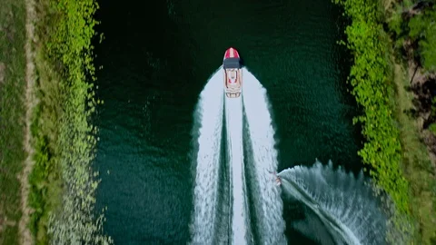 Top Down View of Waterskier Pulled by Boat on Resort Lake.
Professional Stock Footage 122933832