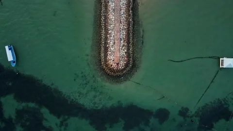 Top down view on wave breaker on balinese beach Stock Footage 156312522