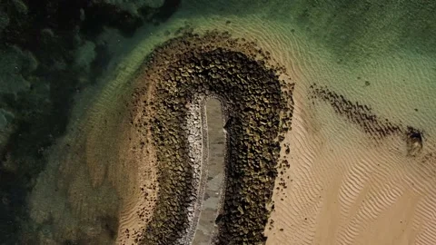 Top down view on wave breaker on balinese beach Stock Footage 156430839