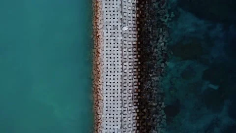 Top down view on wave breaker on balinese beach Stock Footage 165773753